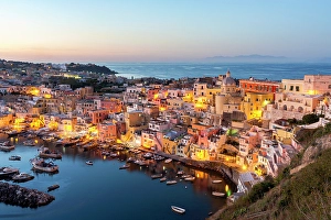 Campania Prints: High angle view of the picturesque old town and harbor at dusk