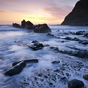 High tide on Duckpool beach at sunset, North Cornwall, England. Spring