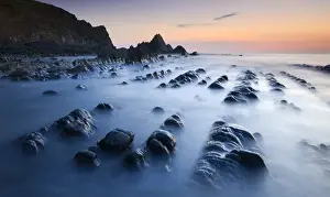 Blurred Motion Prints: High tide gradually submerges the rocky shores of Blegberry Bay at sunset, Hartland