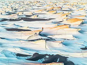 Catamarca Prints: Hiker admiring the pumice fields, Campo de Piedra Pomez, El Penon, Argentina. (MR)