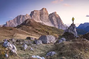 Environment Prints: hiker on the alpine pasture of Alpe Prendera facing the north-west wall of the mount Pelmo