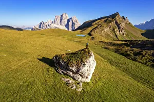 Cadore Prints: Hiker with backpack admiring Mount Pelmo and Baste lake