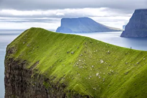 Awlrf Prints: Hiker over a cliff in Kalsoy, Faroe Islands, Europe