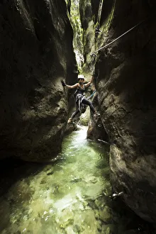 a hiker is climbing along the Stretta di Luina klettersteig, Casto, Brescia province