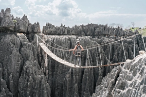 Suspension Bridge Prints: Hiker crosses a rope bridge. Madagascar, Africa. Tsingy De Bemaraha