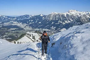 Hiker at Fellhorn with view at Oberstdorf and Nebelhorn, Allgau, Bavaria, Germany (MR)