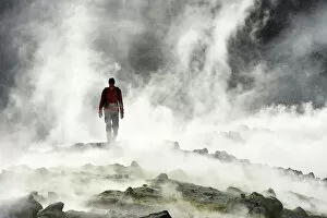 Aeolian Gallery: Hiker on the Gran craters walks through Steam, Vulcano Island, Aeolian, or Aeolian