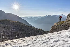 Hiker looking to the valley from the Peterskopfl, Ginzling, Zillertal, Tyrol, Austria