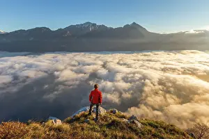Above The Clouds Prints: Hiker looks Grigna group and lake Como (ramo di Lecco) covered by the fog