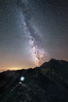 Images Dated 31st October 2022: Hiker under the Milky Way at Agnello Pass, Valle Varaita, Piedmont, Italy