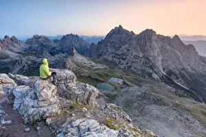 Sexten Prints: Hiker on the top of mount Paterno / Paternkofel looking the sunrise, Sexten Dolomites