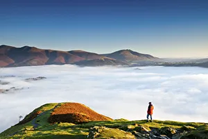 Hiker Overlooking Low Cloud From Catbells, Lake District National Park, Cumbria, England