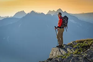 Hiker in Peterskopfl at sunrise Europe, Austria, Zillertal, Peterskopfl, Keisergebirge