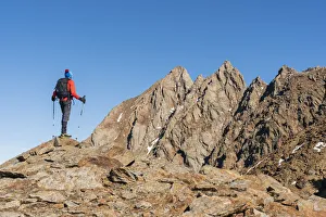 Outdoor Pursuits Prints: Hiker between the rocks of Monticello peak in val Cane