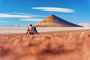 Salta Prints: Hiker sitting in the desert looking at Arita Cone
