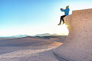 Sitting Prints: Hiker snapping photos with smartphone