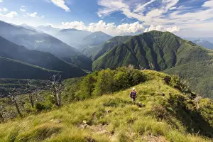 Trekker Prints: Hiker walks on Monte Legnoncino with Valvarrone and Valsassina in the background