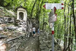 Images Dated 22nd April 2022: Hiker woman with dog and little boy walking on path, Piuro, Valchiavenna, Valtellina