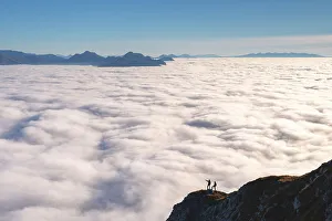 Above The Clouds Gallery: Hikers admiring the beautiful of nature in the mountains, Brescia prealpi in Brescia province in