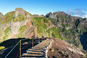Images Dated 7th August 2023: Hikers hiking trail around Pico do Arieiro peak at sunrise, Santana, Madeira, Portugal