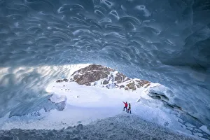 Walker Prints: Hikers inside the ice cave in Val Roseg, Pontresina, Canton of GraubAonden, Engadine