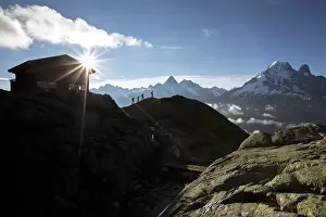 Trekker Prints: Hikers leave the Refuge Lac De Cheserys to venture on the paths at high altitude Chamonix
