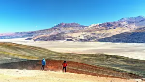 Exploration Prints: Two hikers looking at Salar de Antofalla salt flat, Puna, Catamarca, Argentina. (MR)