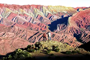 Males Prints: Hikers looking at vibrant rocks, Serrania de Hornocal, Humahuaca, Jujuy, Argentina. (MR)