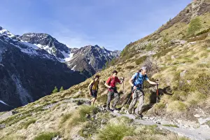 Three People Prints: Hikers on the path with high peaks in the background Val Malga Adamello Regional Park