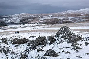 Hikers Prints: Hikers on Sourton Tor on a snowy winter day