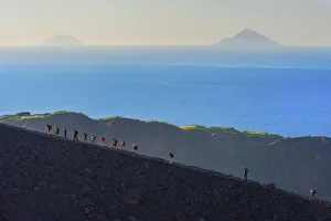 Tyrrhenian Prints: Hikers walking around Gran Crater rim, Vulcano Island, Aeolian Islands, Sicily, Italy