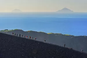 Sicily Gallery: Hikers walking around Gran Crater rim, Vulcano Island, Aeolian Islands, Sicily, Italy