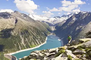Hiking in Zillertal Alps, with Lake Schlegeispeicher and Hochfeiler gruop on