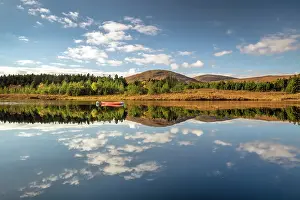 Lewis Prints: Hills and woodland reflecting in Loch na h-Aibhne Ruaidhe