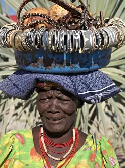 Beaded Necklaces Prints: A Himba street vendor at Opuwo who sells Himba Jewellery