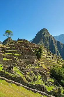 Historic ancient archeological Incan Lost City of Machu Picchu on mountain in Andes, Cuzco Region, Peru