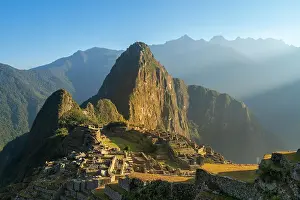 Peru Prints: Historic ancient archeological Incan Machu Picchu on mountain in Andes at sunrise