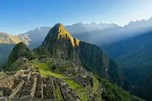 Cusco Province Prints: Historic ancient archeological Incan Machu Picchu on mountain in Andes at sunrise