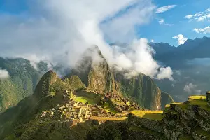 Cusco Province Prints: Historic ancient archeological Incan Machu Picchu on mountain in Andes at sunrise