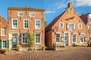Northern German Prints: Historic brick houses at the harbor in Greetsiel, East Frisia, Lower Saxony, Germany