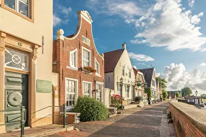 Northern German Prints: Historic brick houses at the harbor in Greetsiel, East Frisia, Lower Saxony, Germany