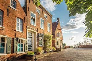 Northern German Prints: Historic brick houses at the harbor in Greetsiel, East Frisia, Lower Saxony, Germany
