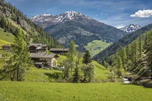 Historic limestone mountain farms in Villgratental, view to Glockenkinkele (2, 675m), East Tyrol, Tyrol, Austria Historic limestone mountain farms in Villgratental, view to Glockenkinkele (2, 675m), East Tyrol, Tyrol, Austria