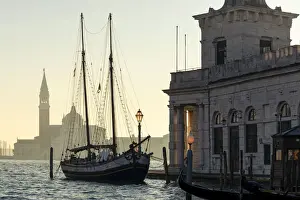 Street Lamp Prints: Historic trabaccolo boat at Punta della Dogana with San Giorgio Maggiore Island in