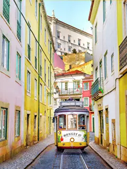 Alfama Prints: Hist√≥ric Alfama District, Street Scene with yellow Vintage Tram Number 28 Lisbon