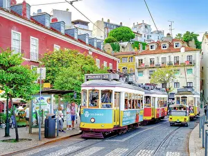 Alfama Prints: Hist√≥ric Alfama District, Street Scene with yellow Vintage Tram Number 28 Lisbon