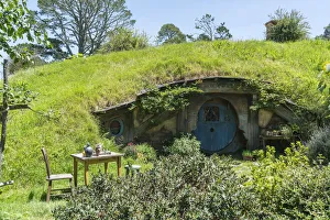 Hobbit house with table and chair in the garden