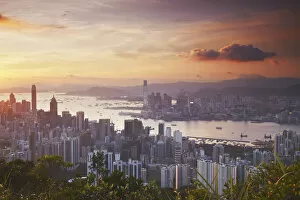 Images Dated 19th September 2011: Hong Kong Island and Kowloon skylines at sunset, Hong Kong, China
