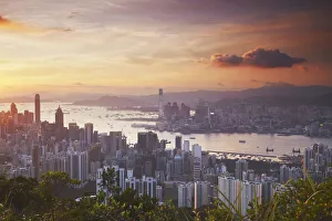 Images Dated 19th September 2011: Hong Kong Island and Kowloon skylines at sunset, Hong Kong, China