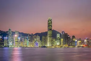 Hong Kong skyline, skyscrapers on Hong Kong Island seen from Tsim Sha Tsui at sunset